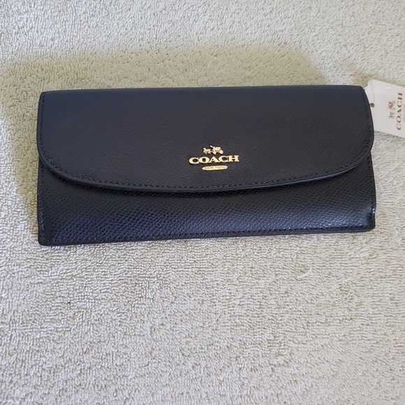 Coach Handbags - Coach navy blue slim wallet